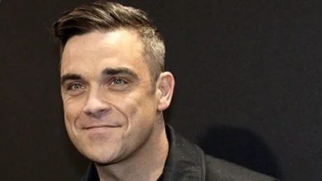 Robbie Williams plânge la reclamele cu bebeluşi